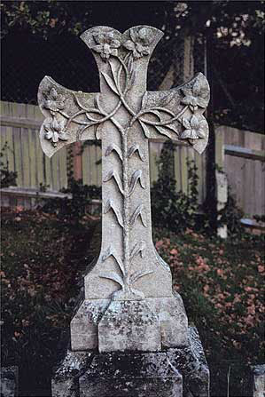 cross decorated with lilies